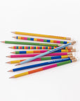 scattered set of colorful pre-sharpened wood pencils with various book compliments on them