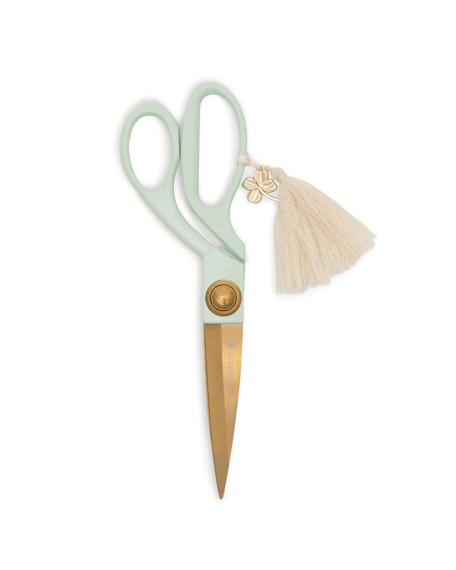 mint scissors with gold shears and white tassel with clover charm
