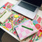 Floral desk pad with planner sitting on it