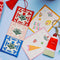 red, pink and blue embroidered folk floral bookmark with red tassel top