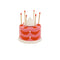 pink and red cake shaped match holder with matches inside