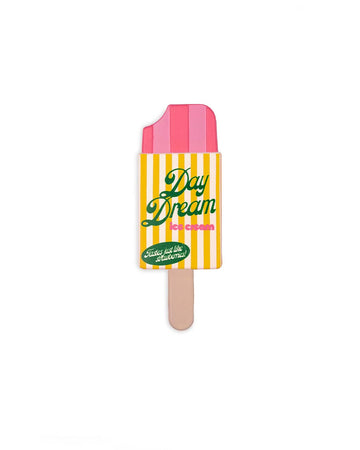 popsicle shaped de-stress ball with yellow and white stripe label that says 'day dream ice cream: tastes like strawberries!'