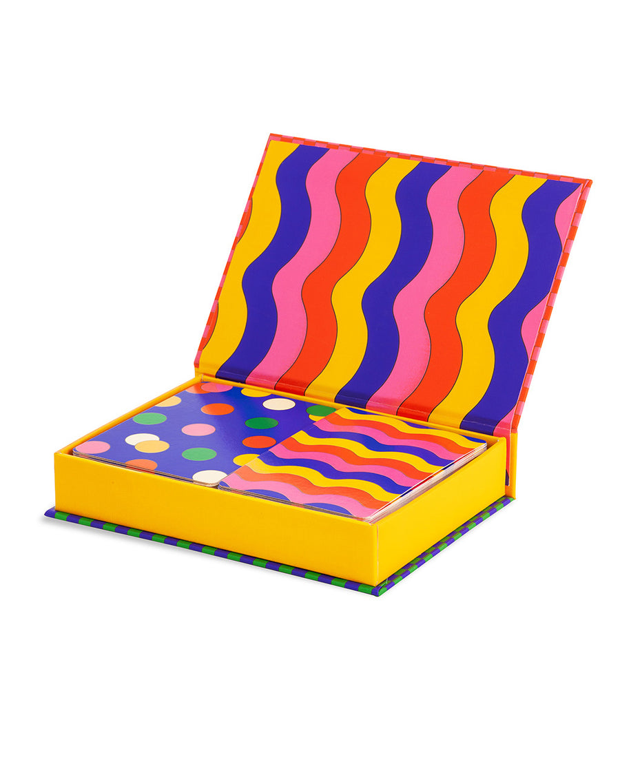 set of two playing card decks (rainbow squiggle and blue polka dot) in a colorful box