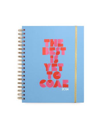 blue large planner with pink and red 'the best is yet to come' and gold elastic closure