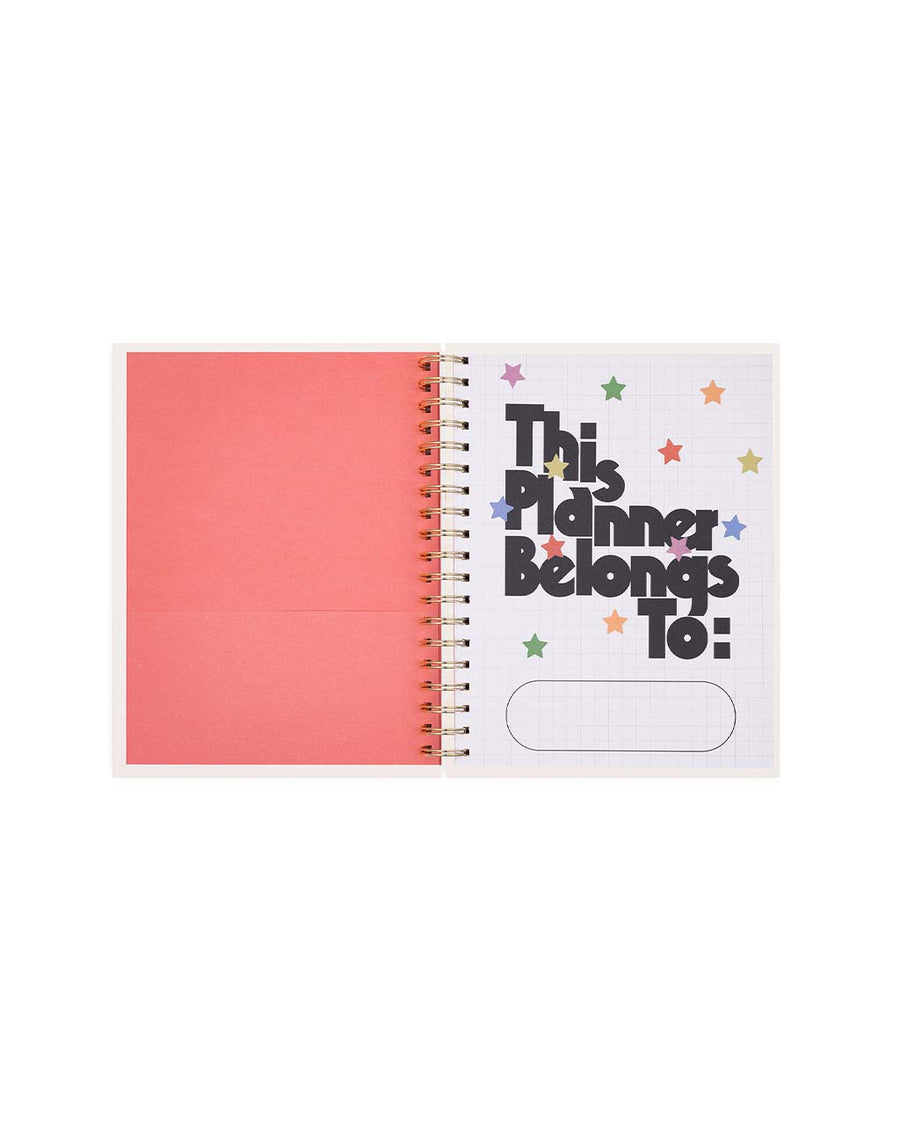 pink interior pocket with 'this planner belongs to:'