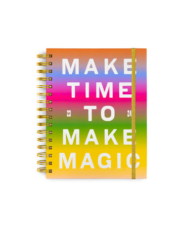 medium 17-month planner with rainbow ombre background and white 'make time to make magic' text across the front