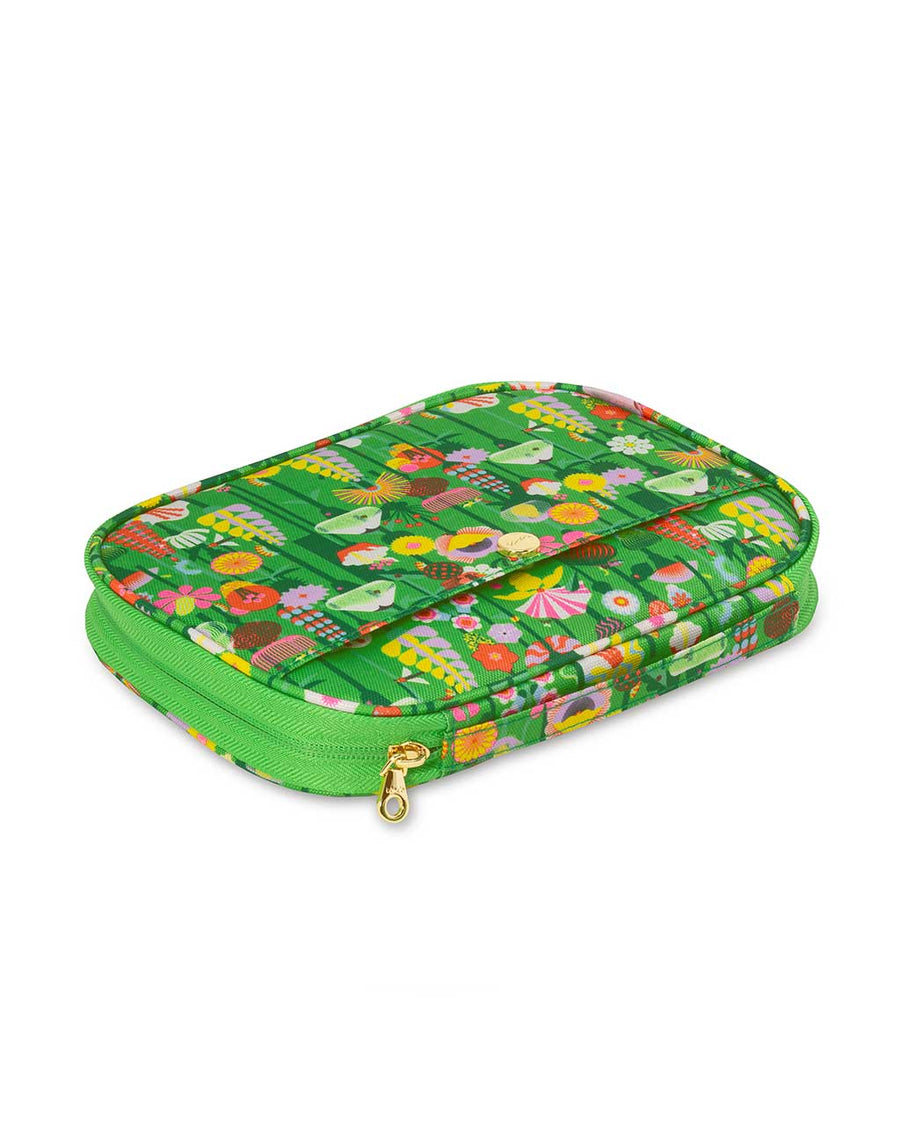 side view of mobile tech pouch with green ground and colorful abstract flower print