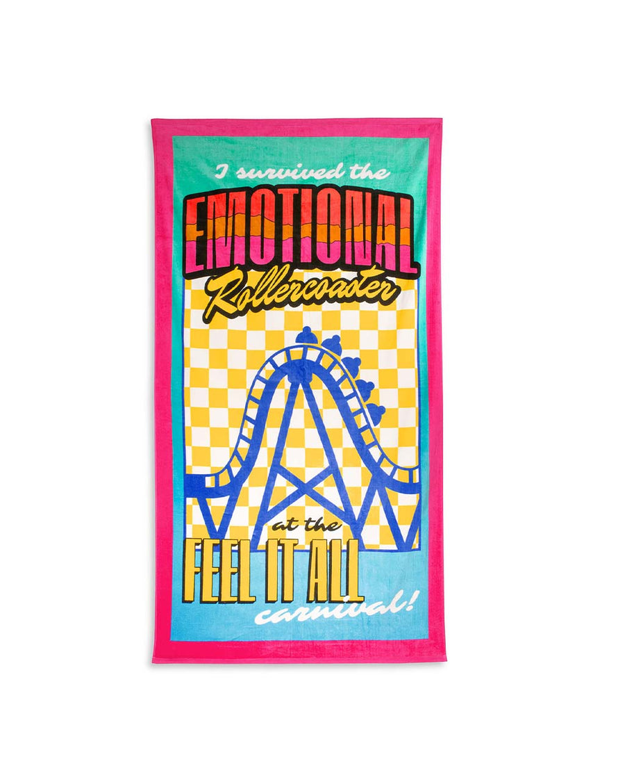 colorful oversized towel with 'i survived the emotional rollercoaster at the feel it all carnival' with graphic on the front