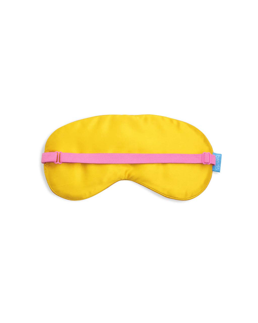 yellow underside of red satin eye mask with cursive 'take a break' across the front