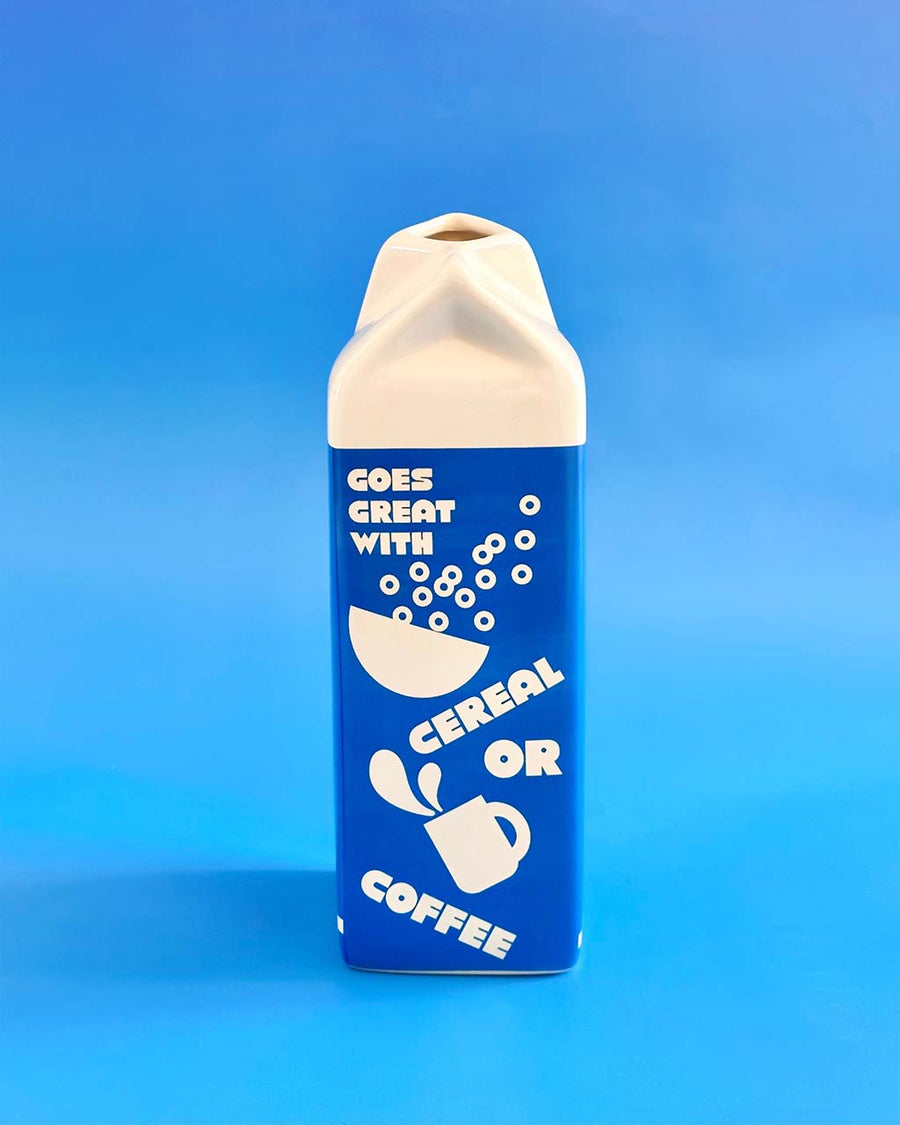 back view of oat milk vase that says 'goes great with cereal or coffee'