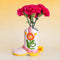 pink cowboy boot vase with yellow and floral accents