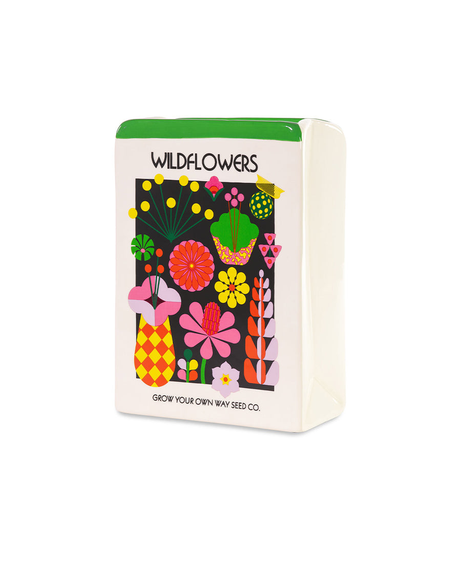 sideview of ceramic vase in the shape of wildflowers seed packet