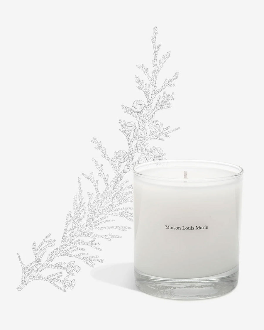 The Le Refuge Dernest candle by Maison Louis Marie is white and comes in a clear glass tumbler.
