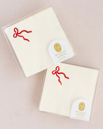 Set of 20 cocktail napkins with classic red bow in the corner