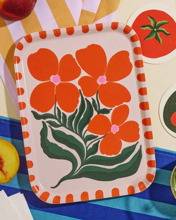 cream tray with abstract orange wildflower print with orange dot trim on a colorful background