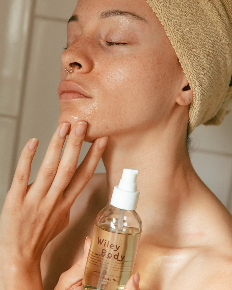 model using glass bottle with everywhere oil