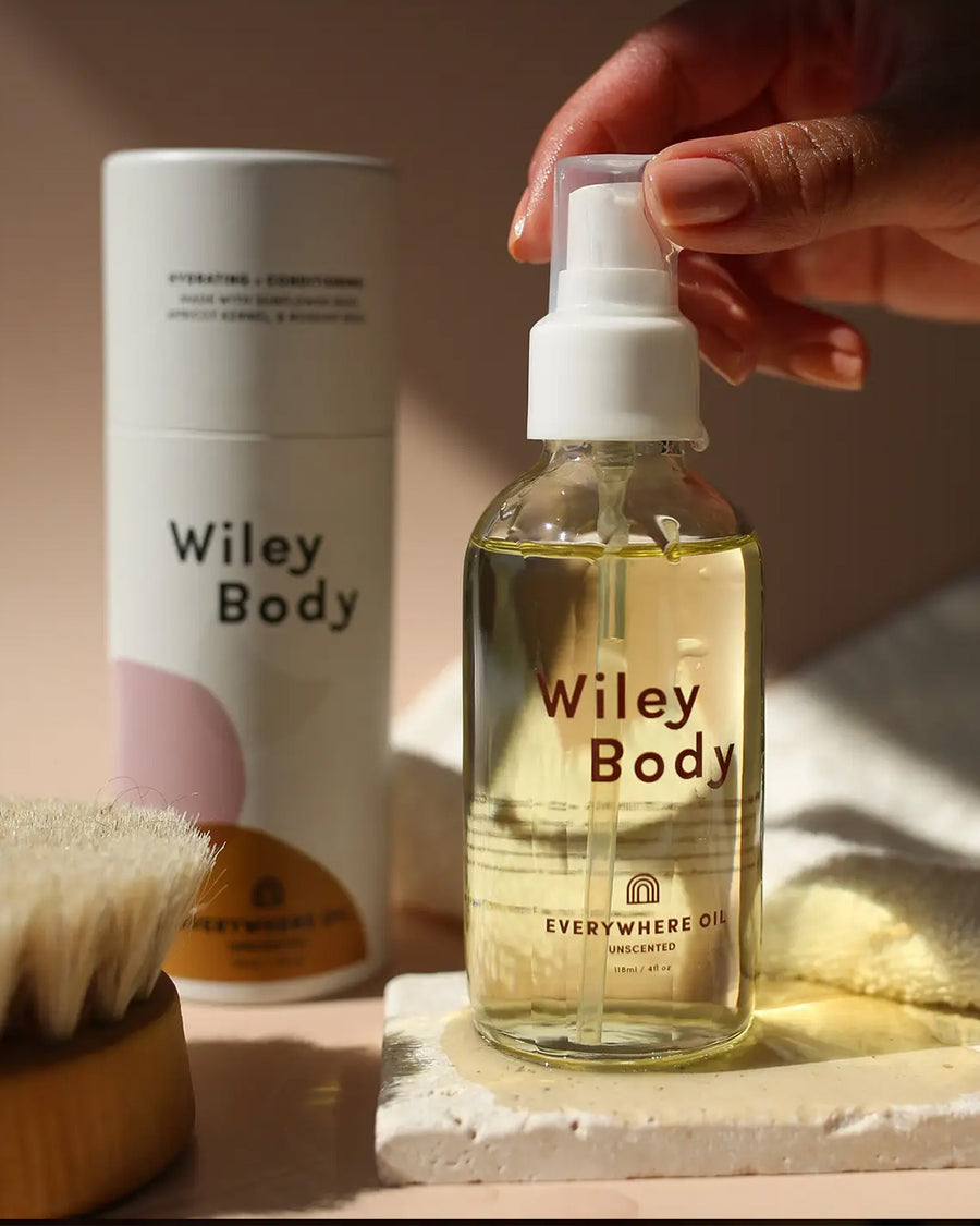 glass bottle with everywhere oil and box in the sunlight