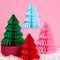 red, pink, dark green and light blue paper accordion tree decor on a pink background