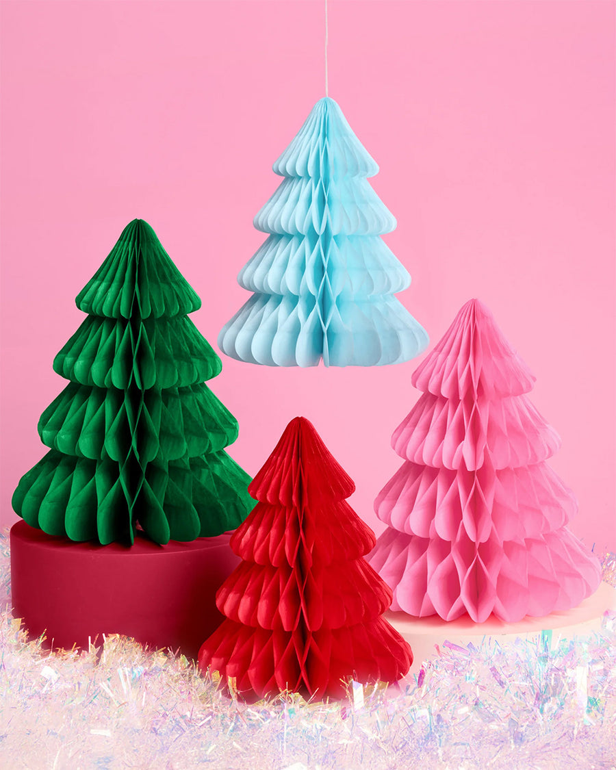 red, pink, dark green and light blue paper accordion tree decor on a pink background