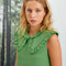 Close up of green hollis mini dress with ruffle collar and silver front zipper