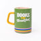 green ceramic mug with yellow handle, rainbow stripe bottom, 'books for breakfast' across the front and 'just a few more pages!' in the inside