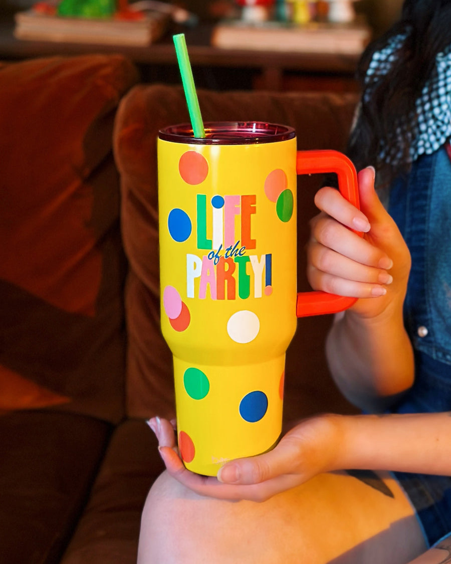 hands holding yellow Life of the Party Tumbler