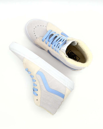 Pair of sherpa lined high top sneakers with gray, cream and blue details
