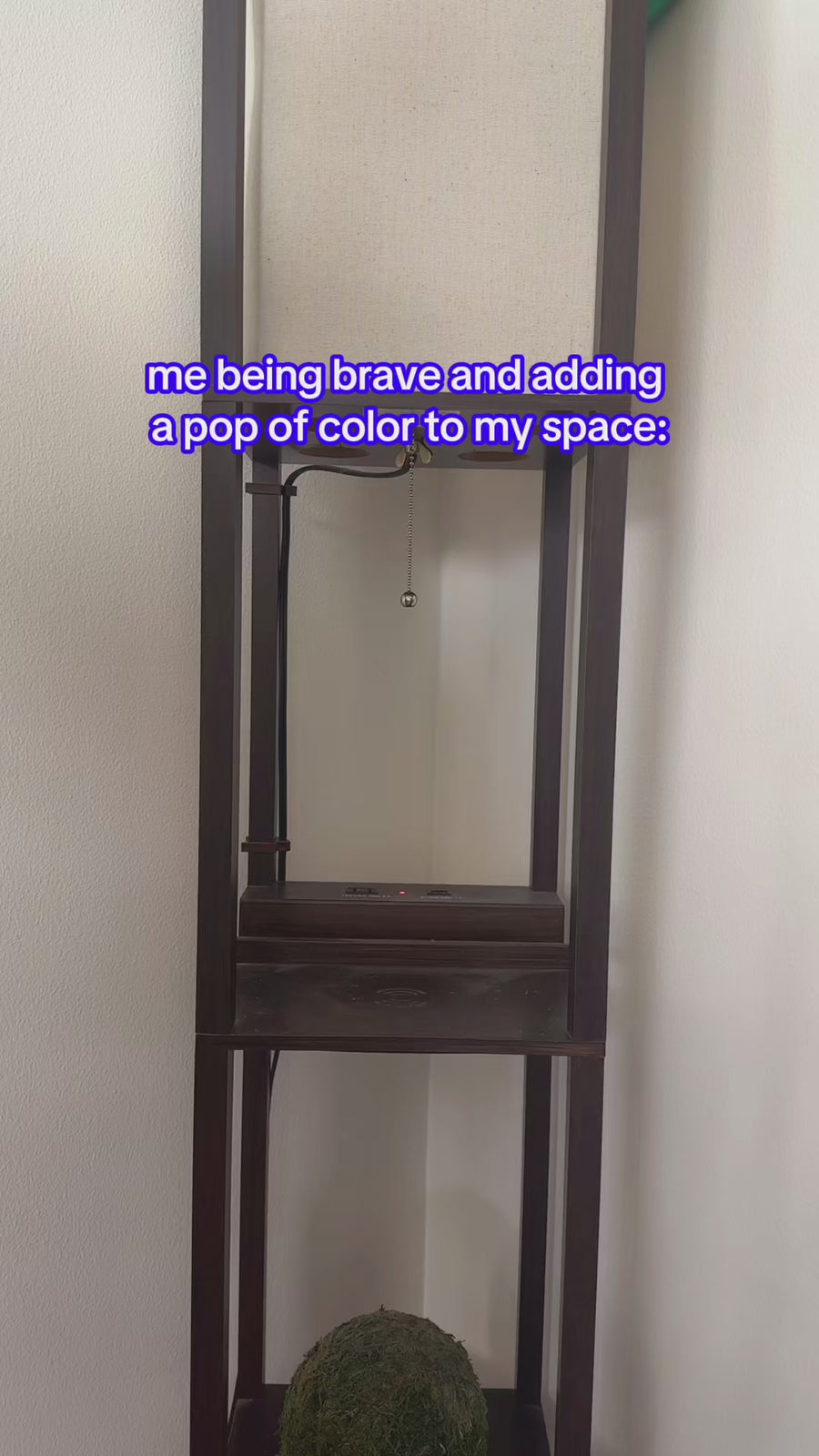 model putting white and blue oat milk vase on a table with the headline 'me being brave and adding a pop of color to my space.'