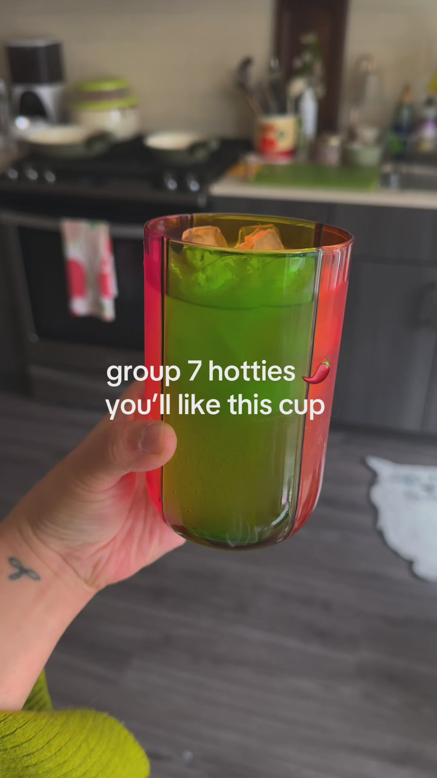 model showcasing colorful high ball glass with the captions 'group 7 hotties, you'll like this cup'