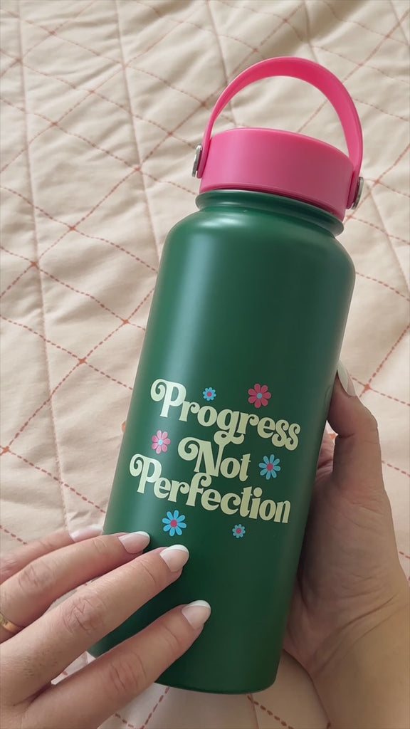 model showcasing progress not perfection water bottle with asmr and showing the lid