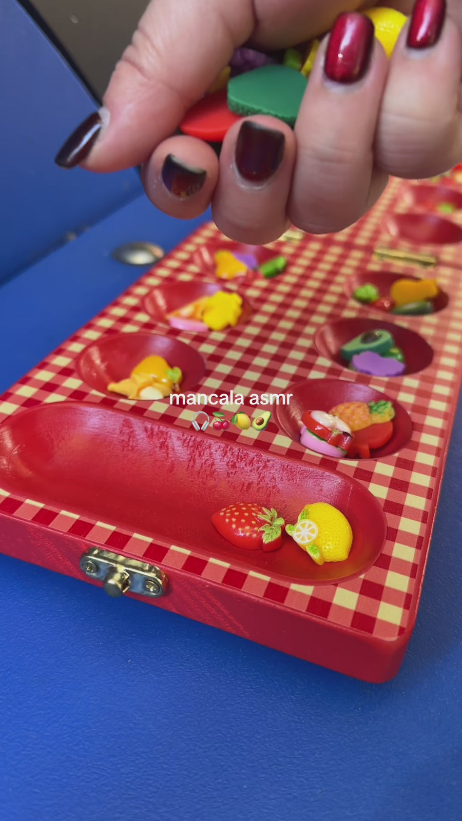 mancala ASMR with model moving pieces in their hands