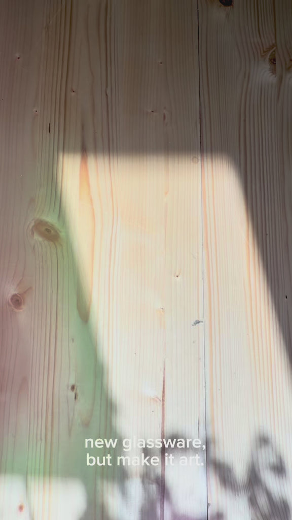 model showcasing colorful high ball glass set in the sunlight