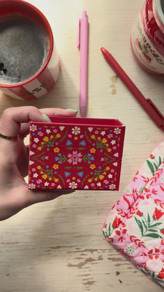 model showcasing folk floral notecard sheets and holder