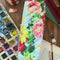 model showcasing colorful floral quilted pencil case
