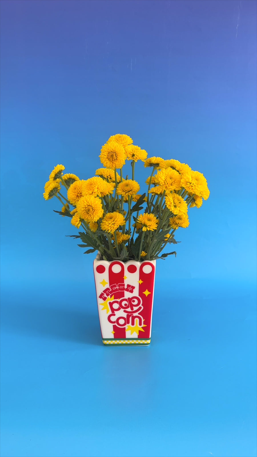 spinning popcorn vase with flowers inside