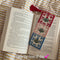 colorful embroidered folk bookmark inside a book pages