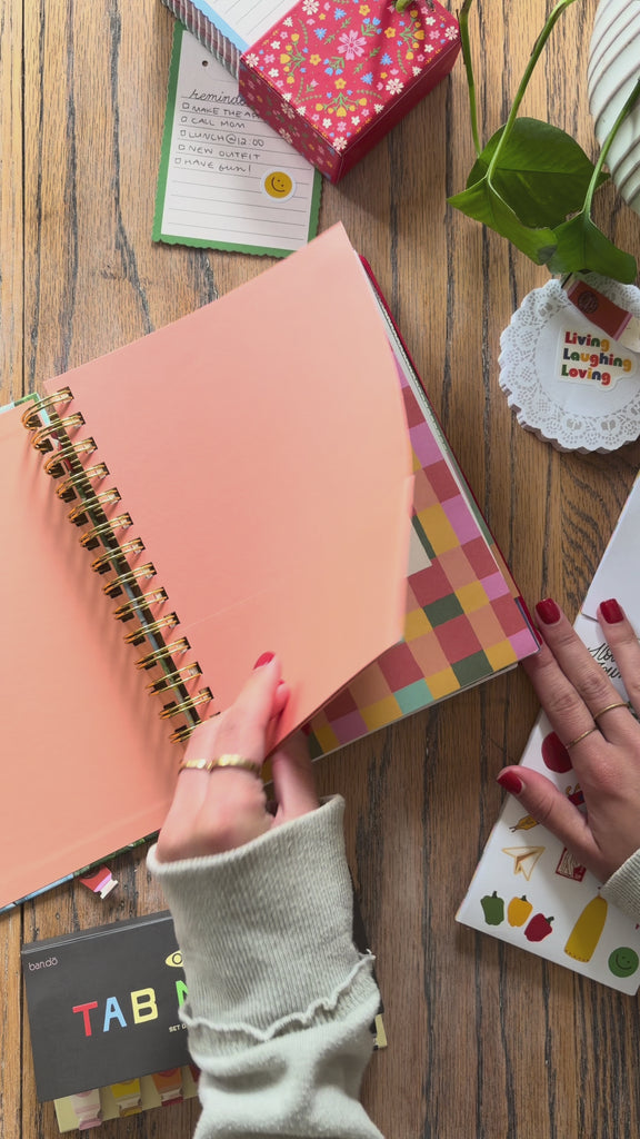 model flipping through medium 17-month planner
