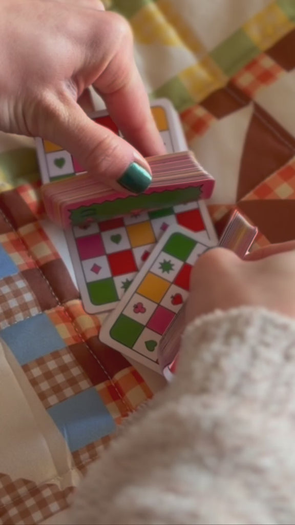 model shuffling colorful card deck