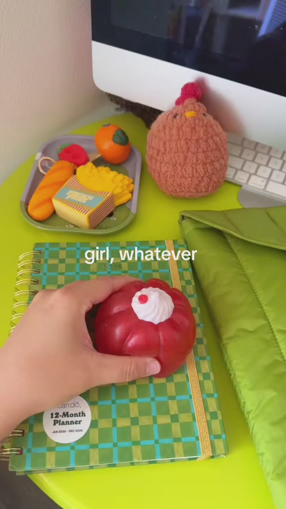 model squeezing pink jelly dessert de-stress ball