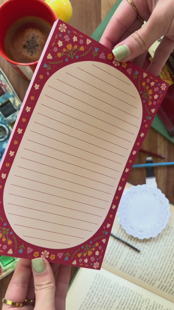 model showcasing red folk floral notepad