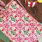 model showcasing pink folk floral quilted pouch