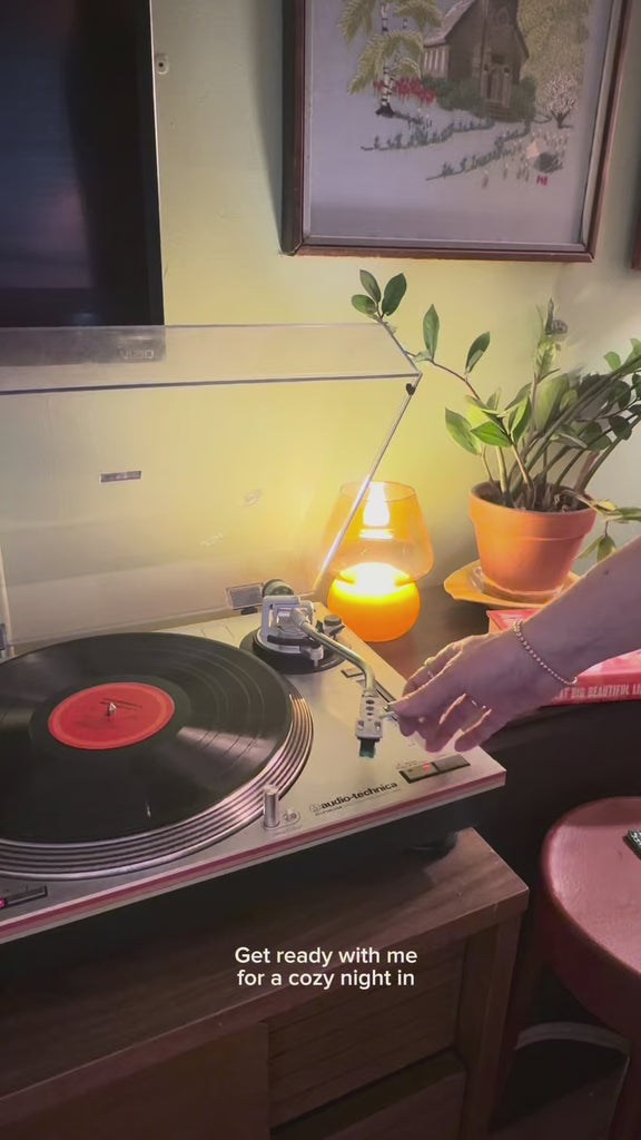 model lighting candle for a cozy night in