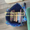 model filling blue tote bag with books!