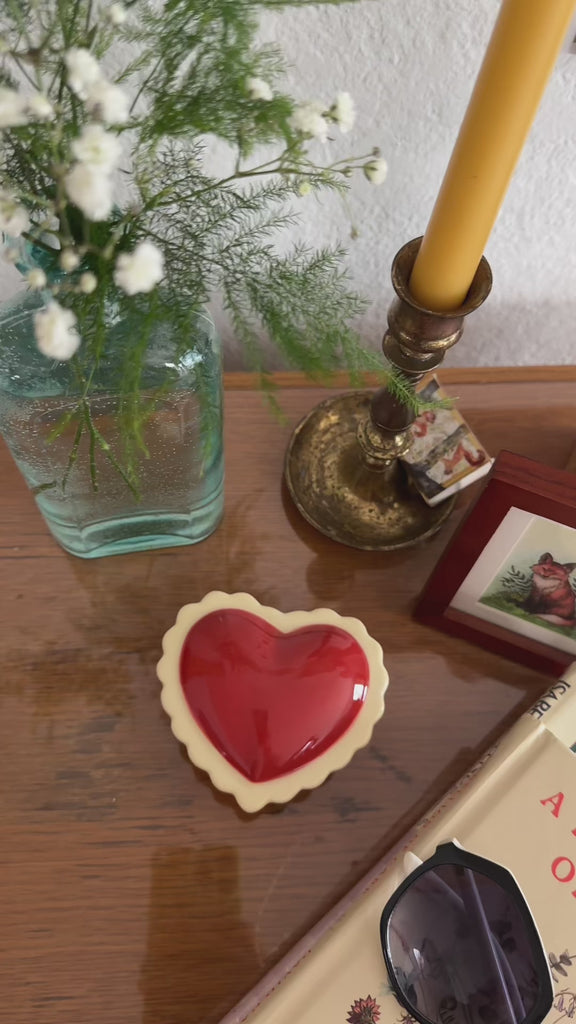 model opening red heart shaped trinket box with jewelry inside