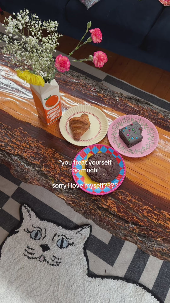 display with various treats on cream with green trim and white with checkered trim dessert plates