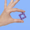 model holding various shades of purple mini magnet fidget toy 