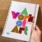 Hand holding a planner, with the words A Work of Art in metallic foil