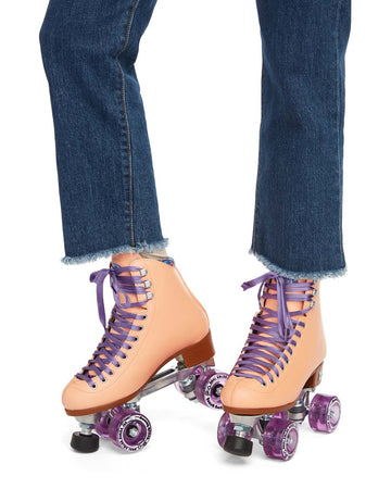 These peach-colored roller-skates feature purple laces and sparkly purple wheels.