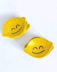 stack of lemonhead shaped trinket dish with smiley face