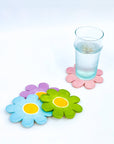 set of 4 daisy coasters with cup on one